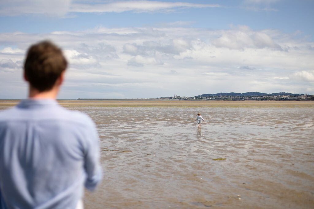 family playing on the beach