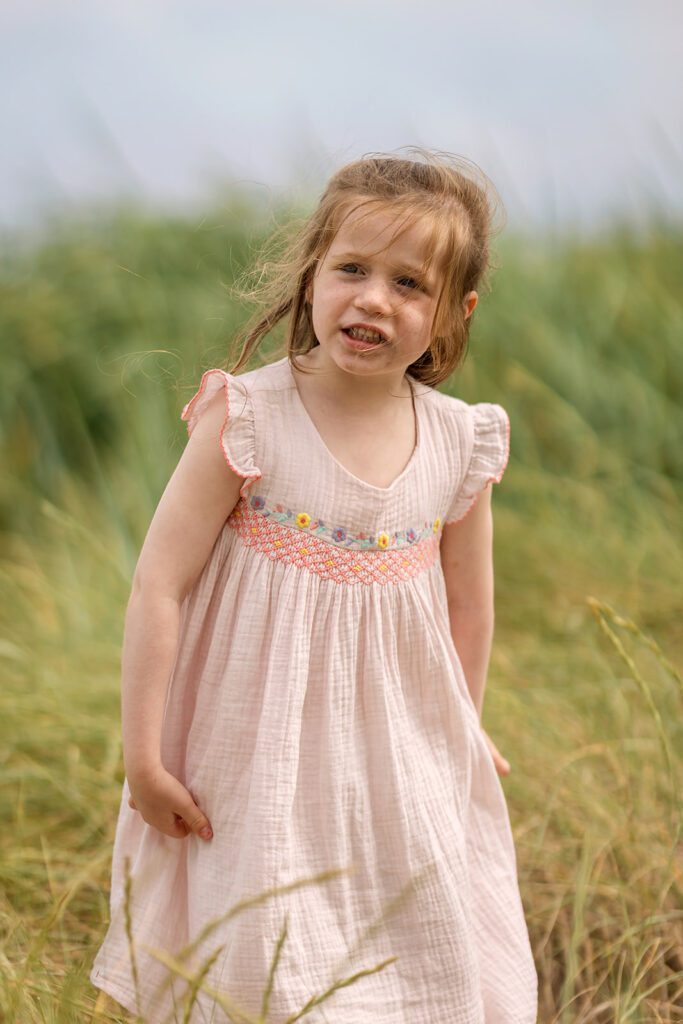little girl exploring the sandymount beach in Dublin, Family Photographer Sandymount
