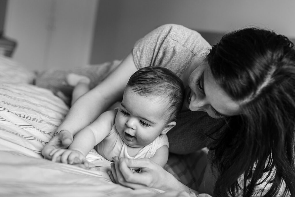 Mom playing with her baby for a solo mum family photo session