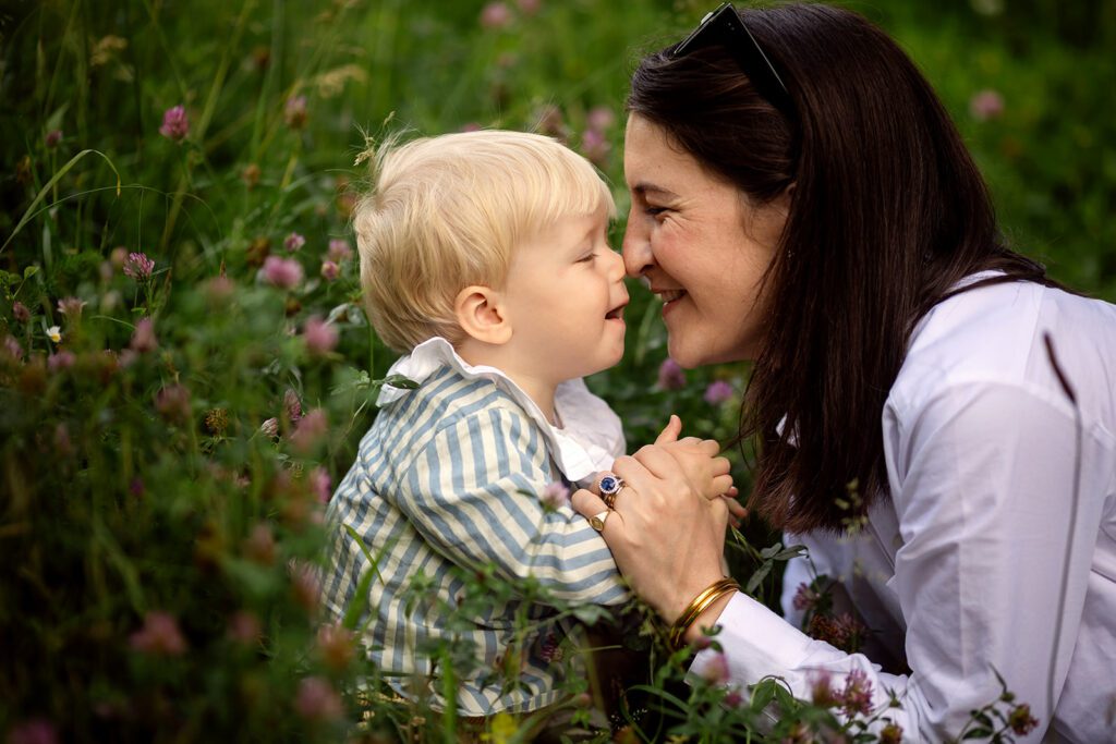 mom playing with her kid at the park for a solo mum family photo session in Dublin