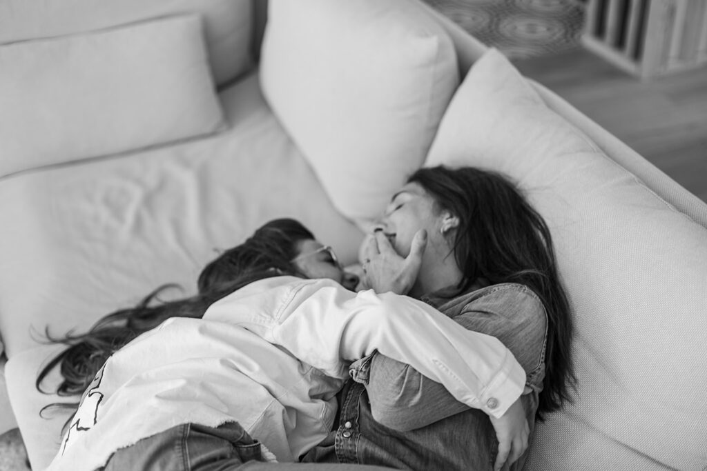 mum cuddling and laughing at home with her kid