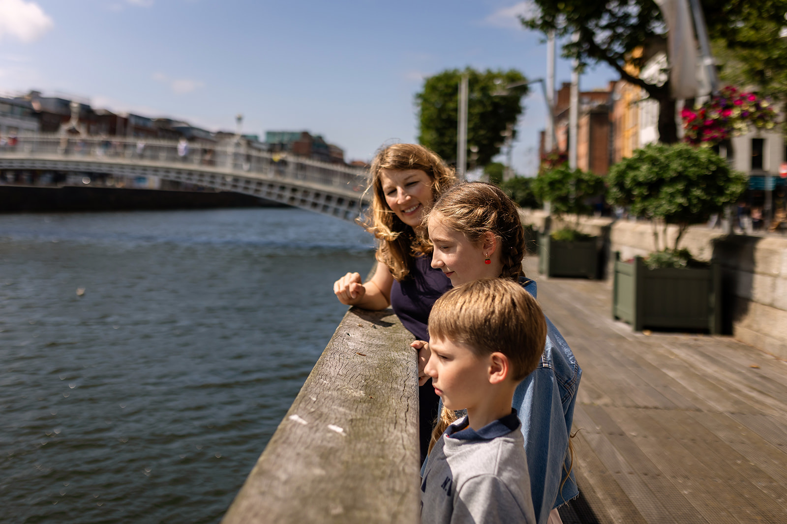 family visiting the Liffey River in Dublin