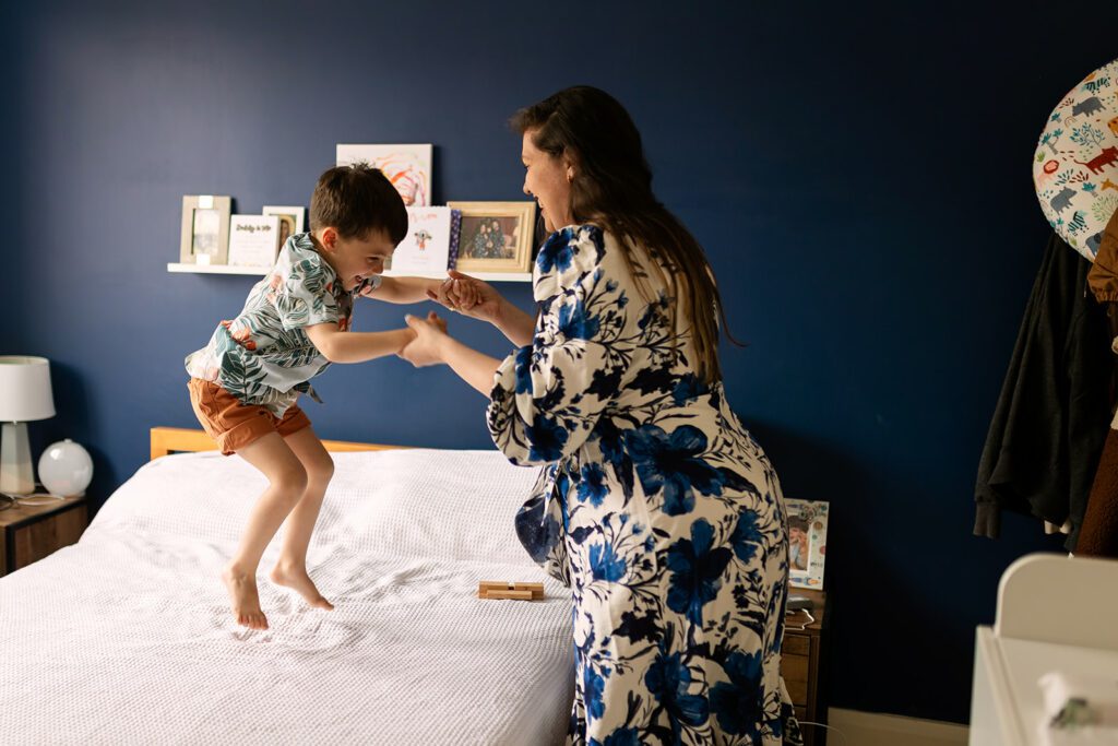 kid jumping on the bed and laughing