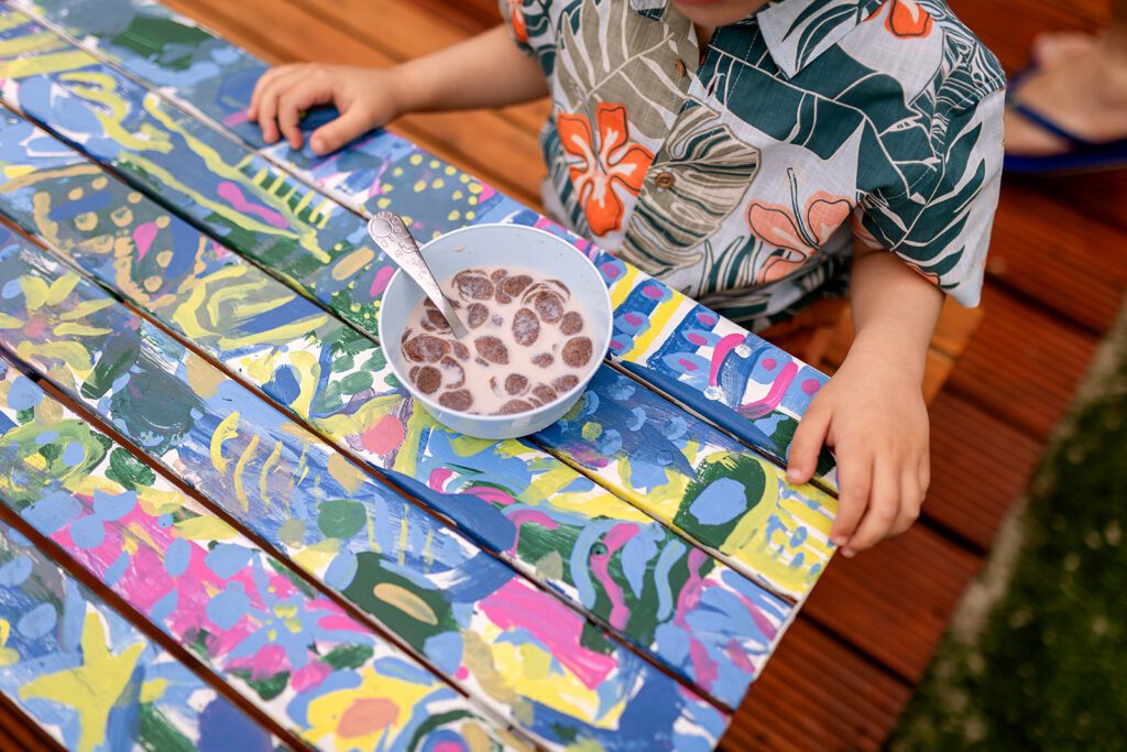 kid having a snack in his backyard in Dublin 15 for a documentary family photo session