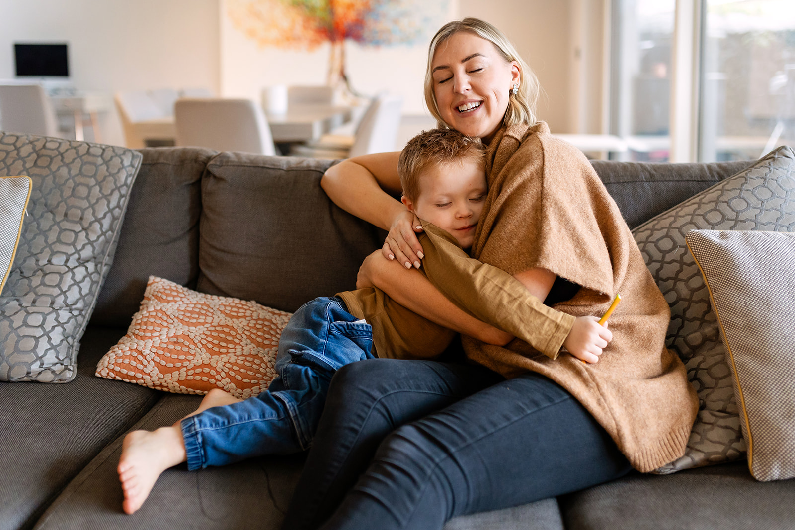 mother and child cuddling in their home in dublin during a family photography session