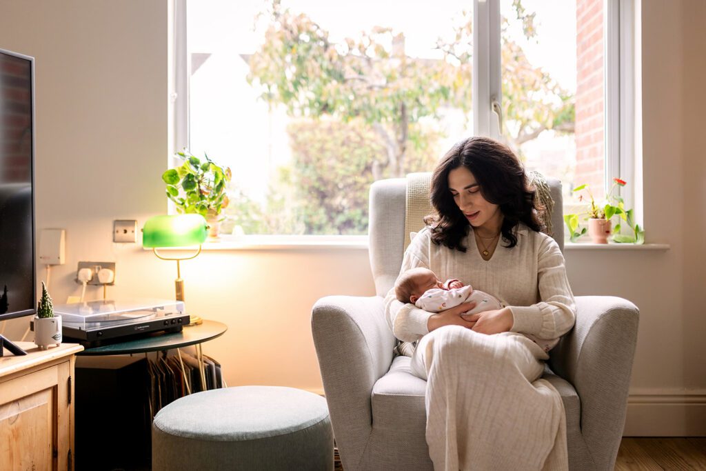 mom and newborn cuddling at home in Dublin