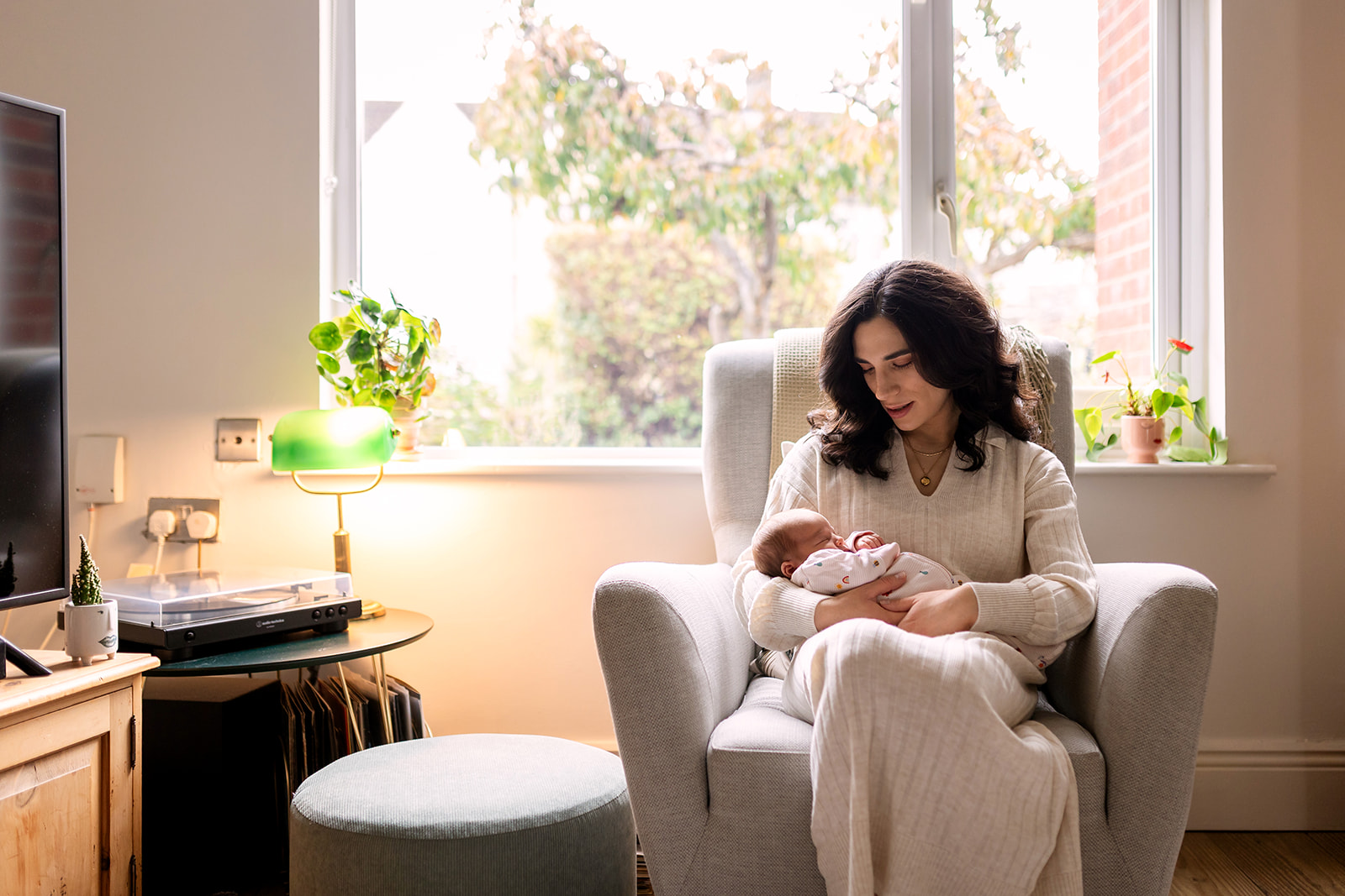 mom and newborn cuddling at home in Dublin