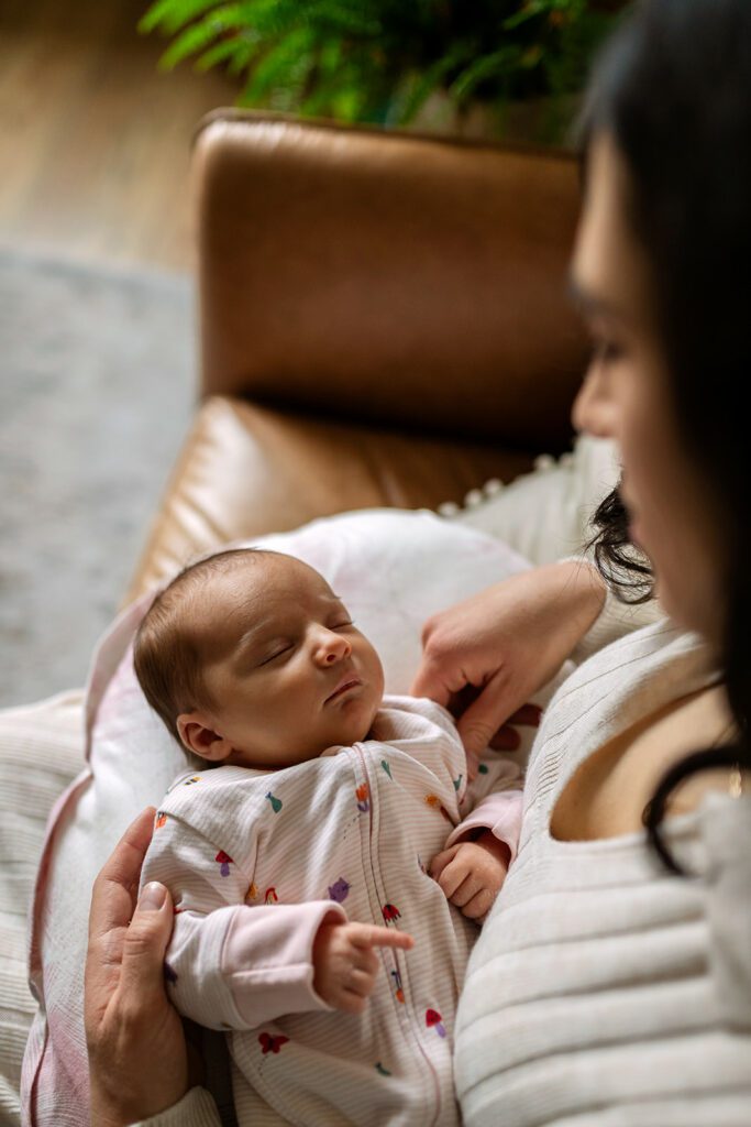 mother holding her newborn during a newborn photo session in dublin