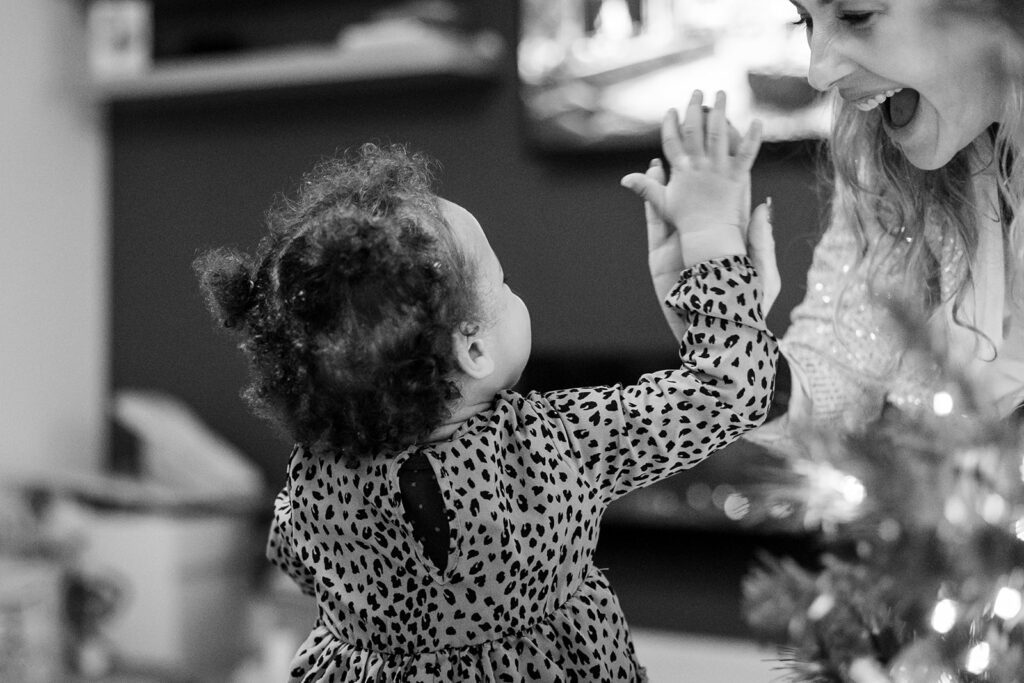 toddler and mom doing a high five