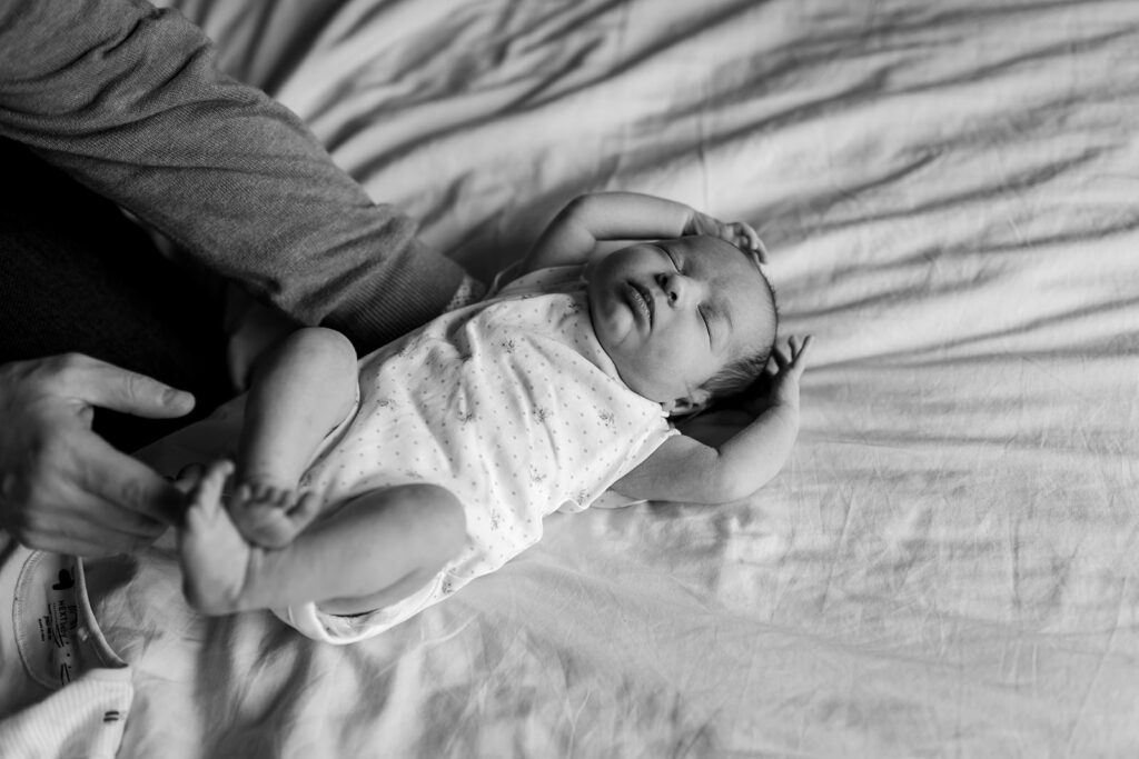 newborn sleeping and stretching