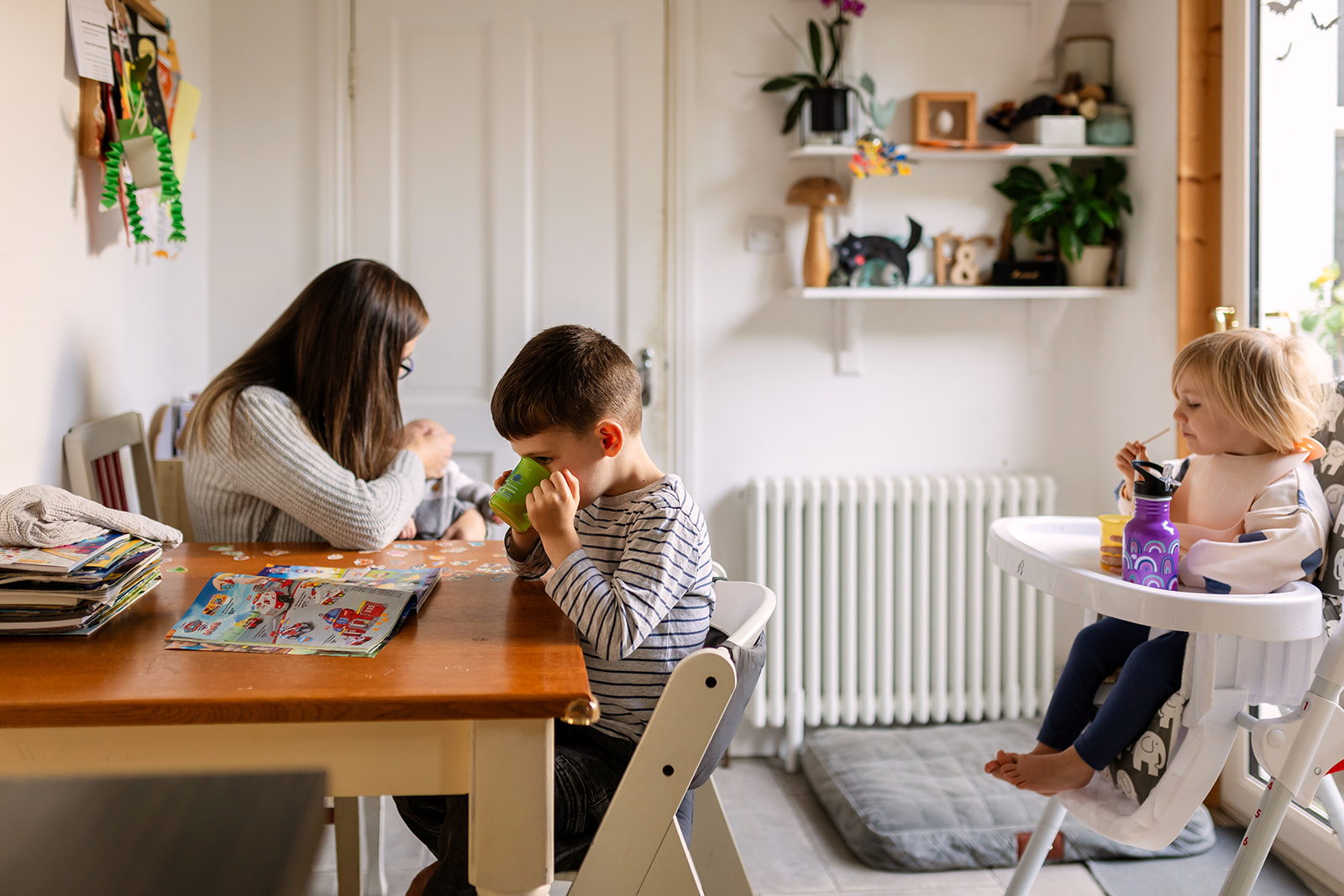 mom and kids having a snack in their kitchen in Dublin