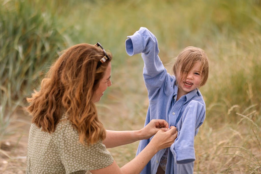 Mother and her little girl at the beach during a child-led photography session in Dublin