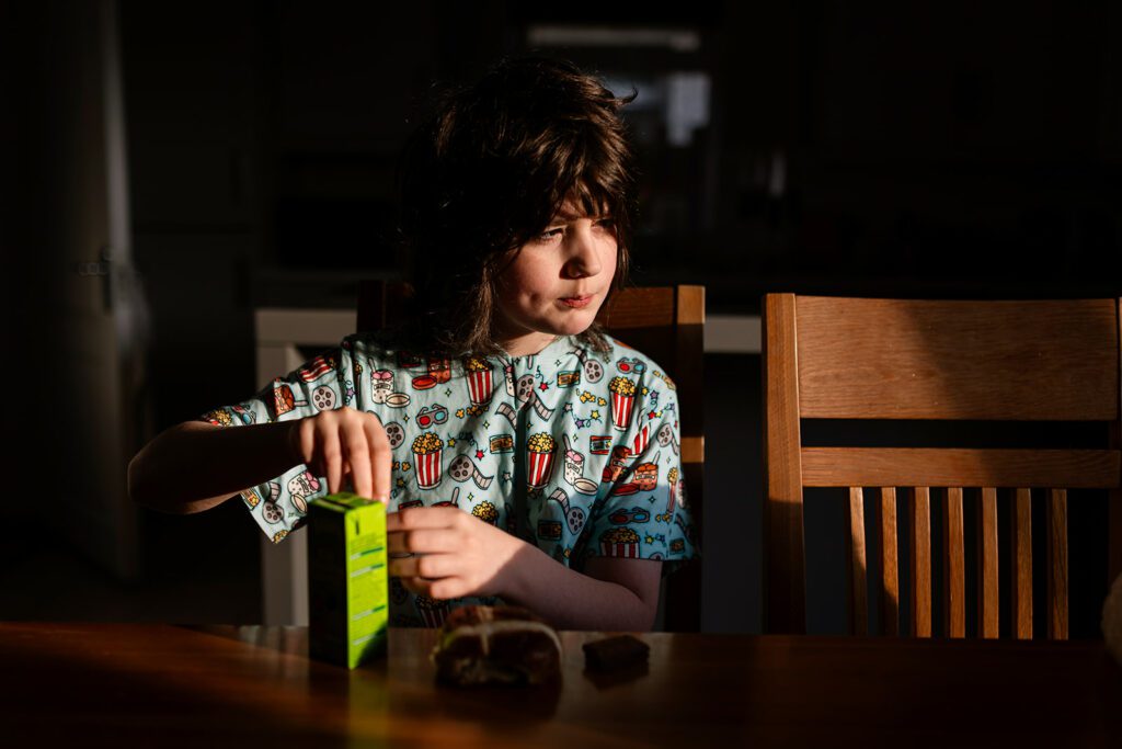 child having breakfast at home