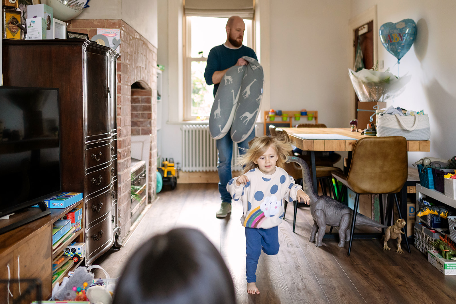 family living their normal life at home, playing