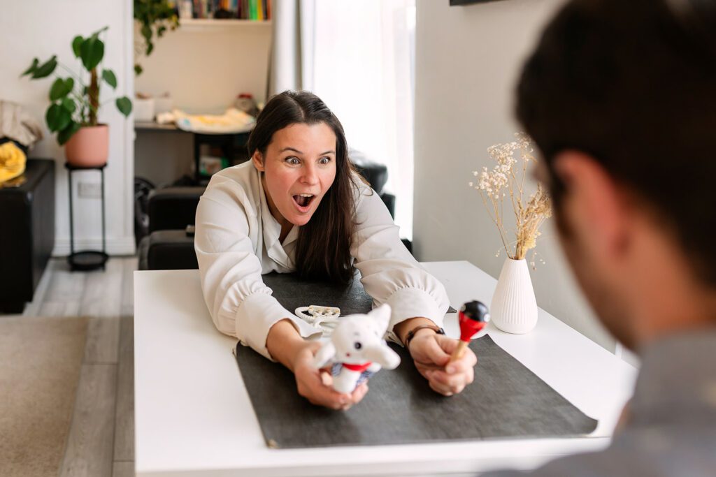 mom making faces to make her baby smile