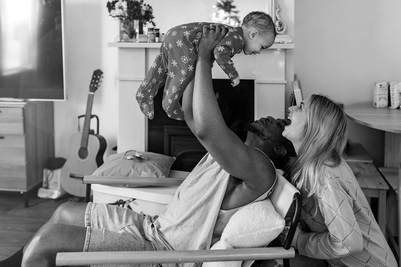 parents playing with their baby girl at home in Dublin