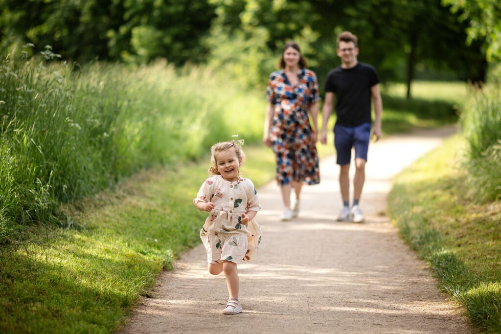 family walking at the park on a sunny day