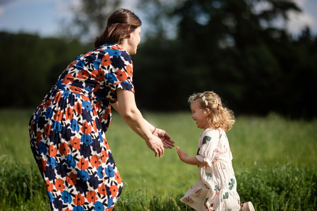 mum playing with toddler at the park