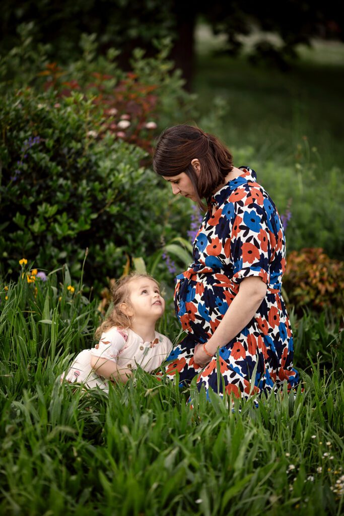 mum and little girl at an outdoor park for Outdoor maternity photos in Dublin