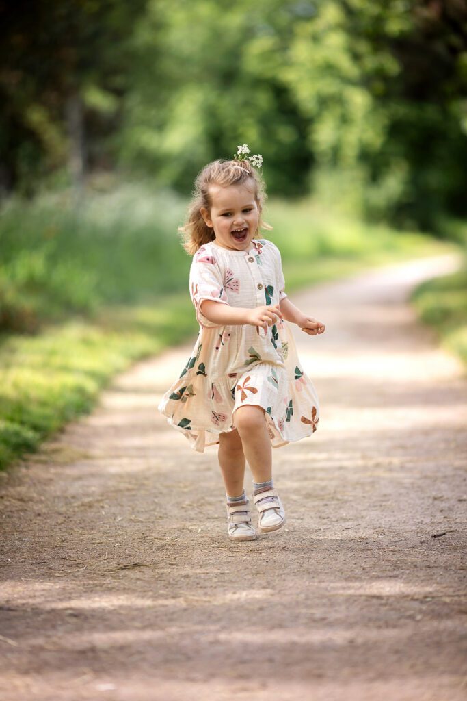 Little girl running along the Royal Canal in Clonsilla during a family mini session