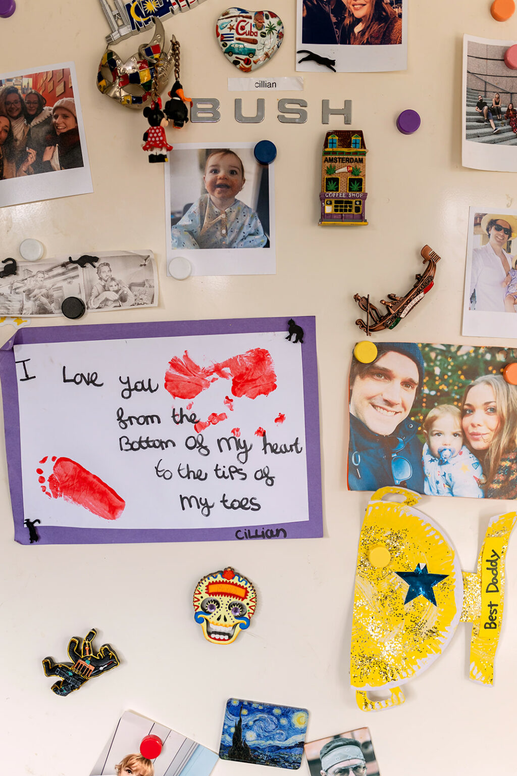 Family photographs and children's artwork attached to a refrigerator